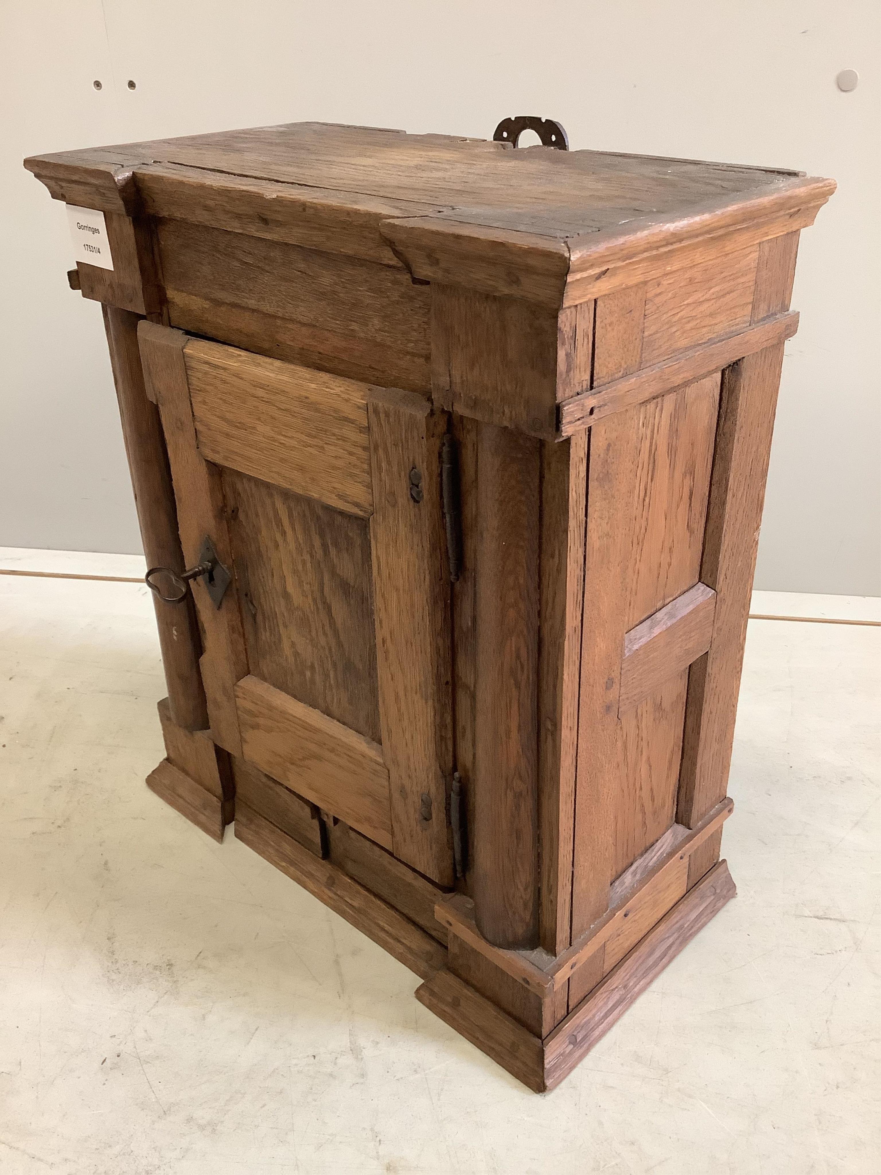 A small oak cupboard, width 38cm, depth 20cm, height 45cm